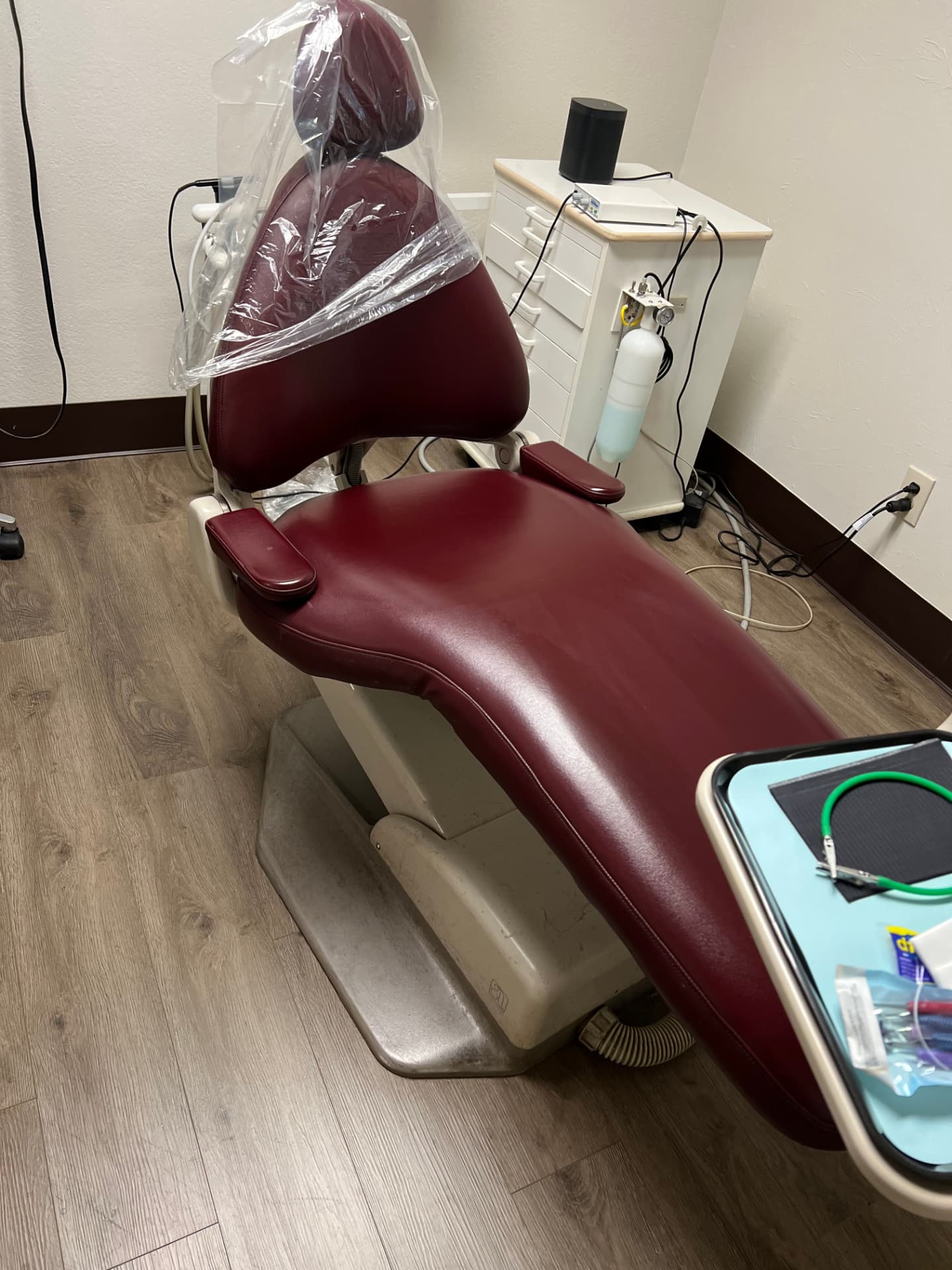 Dental chair restored in burgundy upholstery